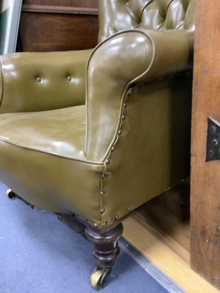 A Victorian buttoned library chair upholstered in olive green leatherette, width 70cm, depth 70cm, height 86cm